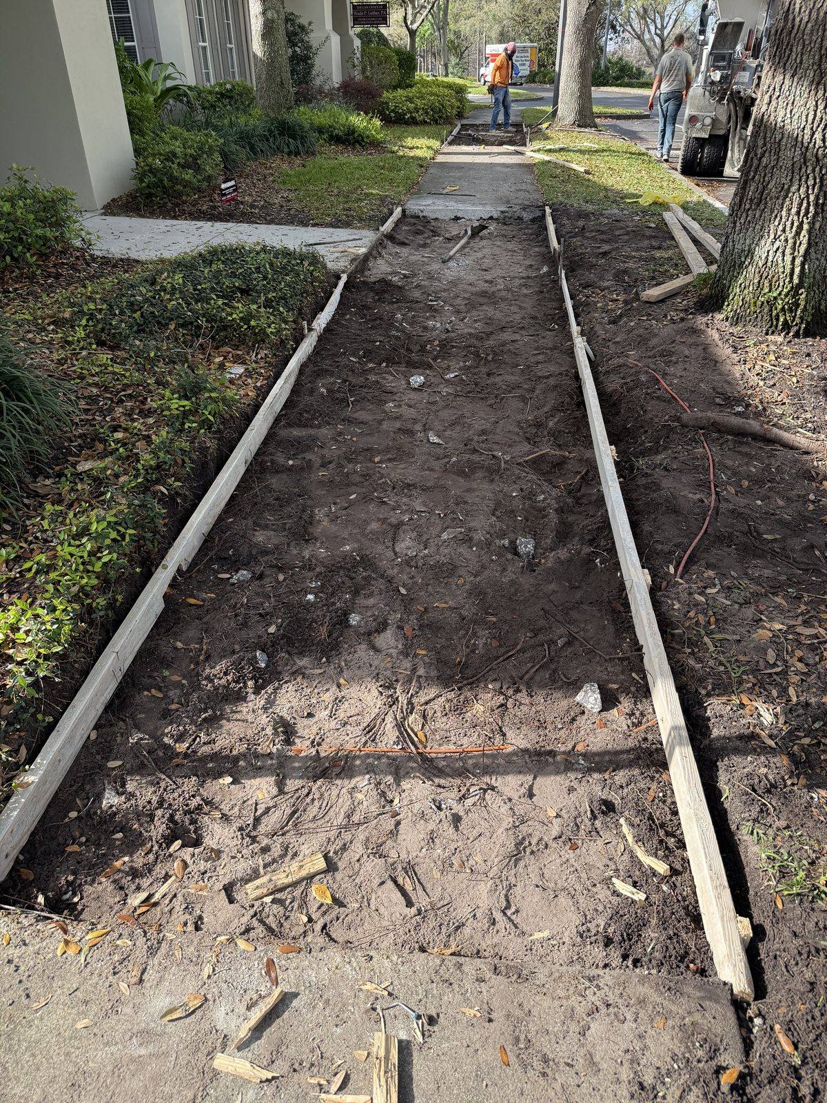 Before: Concrete sidewalk replacement